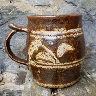 A tankard made at Morar Pottery with Alex's personal seal and the Morar Pottery MP seal at the base of the handle